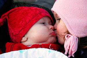300px-Smooches_%2528baby_and_child_kiss%2529.jpg